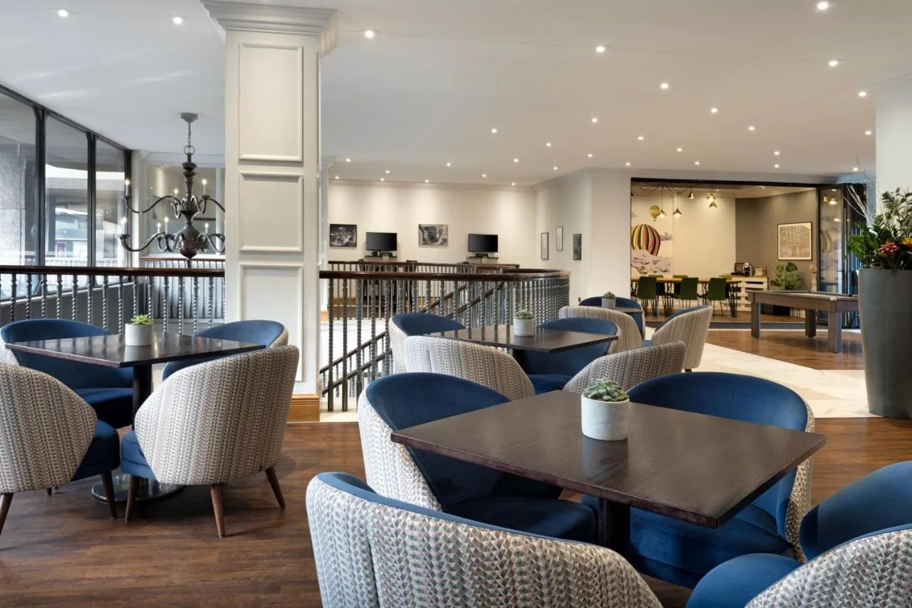 a restaurant with tables and chairs at Delta Hotels by Marriott Bristol City Centre in Bristol